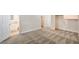 Bright bedroom featuring neutral walls, plush patterned carpeting, and walk-in closet at 4889 W Montara Cir, Las Vegas, NV 89121