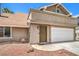 Charming home features a two-car garage and low-maintenance landscaping at 4889 W Montara Cir, Las Vegas, NV 89121