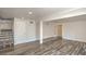 Bright living room has wood floors and access to the staircase and other rooms at 4889 W Montara Cir, Las Vegas, NV 89121