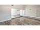 Spacious living room featuring modern wood floors and ample natural light at 4889 W Montara Cir, Las Vegas, NV 89121