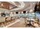 Stylish bar area with comfortable seating, modern lighting, and scenic views for socializing at 4924 Cedar Lawn Way, Las Vegas, NV 89130