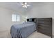 Comfortable bedroom with neutral decor, including a dark wood dresser at 4924 Cedar Lawn Way, Las Vegas, NV 89130