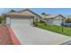 Lovely single-story home with a spacious driveway and verdant landscaping at 4924 Cedar Lawn Way, Las Vegas, NV 89130