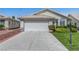 Charming single-story home with a well-manicured lawn and a two-car garage at 4924 Cedar Lawn Way, Las Vegas, NV 89130