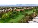 Scenic golf course featuring rolling green fairways, mature trees, and distant mountain views on a sunny day at 4924 Cedar Lawn Way, Las Vegas, NV 89130