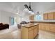 Bright, open kitchen with island and ample cabinetry and stainless steel appliances at 4924 Cedar Lawn Way, Las Vegas, NV 89130