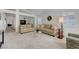 Bright living room featuring neutral walls, plush carpeting, and lots of seating at 4924 Cedar Lawn Way, Las Vegas, NV 89130