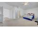 Bright main bedroom with vaulted ceilings leading to the bathroom and closet at 4924 Cedar Lawn Way, Las Vegas, NV 89130