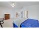 Well-lit main bedroom with ceiling fan and multiple entryways at 4924 Cedar Lawn Way, Las Vegas, NV 89130