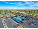 Aerial image featuring community tennis courts, parking, lake, golf course and surrounding landscape at 4924 Cedar Lawn Way, Las Vegas, NV 89130