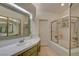 Bathroom with double sinks, tile floors, shower, and separate tub at 5124 Appealing Ct, Las Vegas, NV 89130