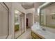 Bright bathroom featuring double sinks, tiled flooring, a shower, and ample space at 5124 Appealing Ct, Las Vegas, NV 89130