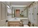 Bathroom with a vanity, large mirror, and shower-tub combination at 5124 Appealing Ct, Las Vegas, NV 89130