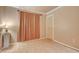 Bright bedroom with hard flooring, peach walls, and a vintage lamp at 5124 Appealing Ct, Las Vegas, NV 89130