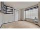 Neutral bedroom offers a window and built-in shelving and ample space at 5124 Appealing Ct, Las Vegas, NV 89130