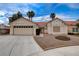 Charming single-story home featuring a two-car garage, desert landscaping, and a classic red tile roof at 5124 Appealing Ct, Las Vegas, NV 89130