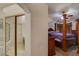 Hallway view with a mirror closet door reflecting a bedroom and bathroom at 5124 Appealing Ct, Las Vegas, NV 89130
