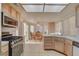 Clean kitchen with stainless steel appliances, breakfast nook, and plenty of light at 5124 Appealing Ct, Las Vegas, NV 89130