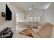 Inviting living room features vaulted ceilings, a ceiling fan, and neutral decor at 5124 Appealing Ct, Las Vegas, NV 89130