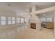 Spacious living area with tile flooring, fireplace, and large windows offering ample natural light at 5124 Appealing Ct, Las Vegas, NV 89130