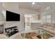Bright living room boasts vaulted ceilings, fireplace, and easy kitchen access at 5124 Appealing Ct, Las Vegas, NV 89130