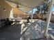 Relaxing covered patio with ceiling fan and outdoor furniture in a spacious backyard at 5255 Autumn Sky Rd, Las Vegas, NV 89118