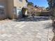 Large backyard featuring brick pavers and covered patio with backyard at 5255 Autumn Sky Rd, Las Vegas, NV 89118
