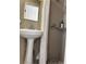 Bathroom features a pedestal sink, modern fixtures and a walk-in shower at 5255 Autumn Sky Rd, Las Vegas, NV 89118