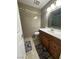Bathroom featuring tiled floors and a vanity with dark wood cabinets at 5255 Autumn Sky Rd, Las Vegas, NV 89118