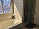Bright bathroom featuring a large bathtub and separate shower at 5255 Autumn Sky Rd, Las Vegas, NV 89118