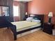 Bedroom with hardwood floors, large window, and closet at 5255 Autumn Sky Rd, Las Vegas, NV 89118