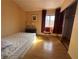 Bedroom features a large window and mirrored closet at 5255 Autumn Sky Rd, Las Vegas, NV 89118