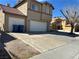 Charming two-story home featuring a tile roof, three car garage and ample parking at 5255 Autumn Sky Rd, Las Vegas, NV 89118