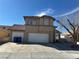 Charming two-story home featuring a tile roof, three car garage and ample parking at 5255 Autumn Sky Rd, Las Vegas, NV 89118