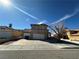 Charming two-story home featuring a tile roof, three car garage and ample parking at 5255 Autumn Sky Rd, Las Vegas, NV 89118
