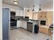 This updated kitchen has stainless steel appliances, and a granite breakfast bar at 5255 Autumn Sky Rd, Las Vegas, NV 89118