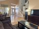 The bright living room features high ceilings, and wood laminate flooring at 5255 Autumn Sky Rd, Las Vegas, NV 89118