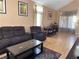 This well lit living room has vaulted ceilings, and features a sofa and table with seating at 5255 Autumn Sky Rd, Las Vegas, NV 89118