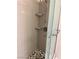 Shower with glass door, shelves, and mosaic tile at 5255 Autumn Sky Rd, Las Vegas, NV 89118