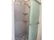 Shower with tile surround, shelves, and glass door at 5255 Autumn Sky Rd, Las Vegas, NV 89118