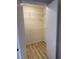 Walk-in closet with wood-look floors and ample storage space with wire shelving at 555 E Silverado Ranch Blvd # 1034, Las Vegas, NV 89183