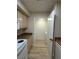 Kitchen area with appliances adjacent to the laundry area at 555 E Silverado Ranch Blvd # 1034, Las Vegas, NV 89183