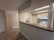Kitchen with breakfast bar, white appliances, and warm wood cabinets at 555 E Silverado Ranch Blvd # 1034, Las Vegas, NV 89183