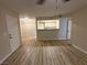 Spacious living room with wood-look flooring and a view of the kitchen at 555 E Silverado Ranch Blvd # 1034, Las Vegas, NV 89183