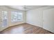 Bedroom with natural light and wood flooring offers a ceiling fan and standard closet at 5710 E Tropicana Ave # 1017, Las Vegas, NV 89122