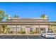 A well-maintained apartment building features designated parking spots, verdant landscaping, and an elegant exterior design at 5710 E Tropicana Ave # 1017, Las Vegas, NV 89122
