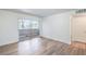 Bright living room with hardwood floors and sliding glass doors to a patio at 5710 E Tropicana Ave # 1017, Las Vegas, NV 89122