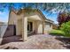 Backyard featuring covered patio, paver flooring, privacy fence, and lush landscaping at 5713 Silver Cascade Ave, Las Vegas, NV 89131