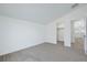 Bedroom features neutral carpet, white walls, base molding and a large closet with a reach in closet at 5713 Silver Cascade Ave, Las Vegas, NV 89131