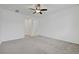 Spacious bedroom with neutral carpet, white walls, and a ceiling fan at 5713 Silver Cascade Ave, Las Vegas, NV 89131